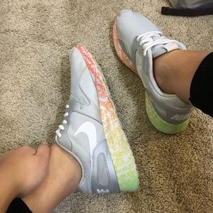 Silver and multicolored Nike Roshes